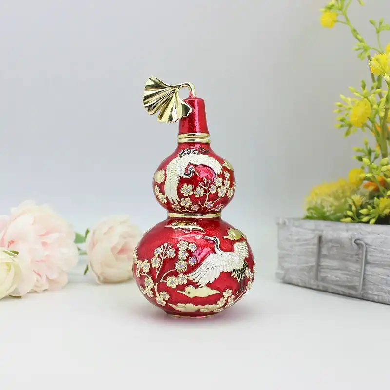 Pewter enamel wu lou trinket box closed showing crystal details and polished finish.