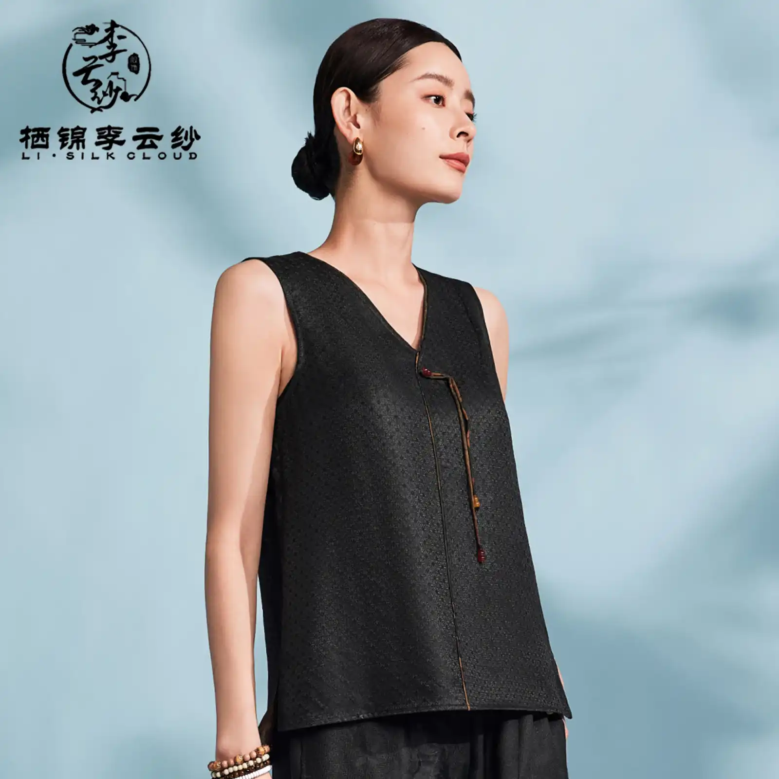 Lifestyle shot of woman in premium Xiangyunsha silk tank for casual summer elegance.