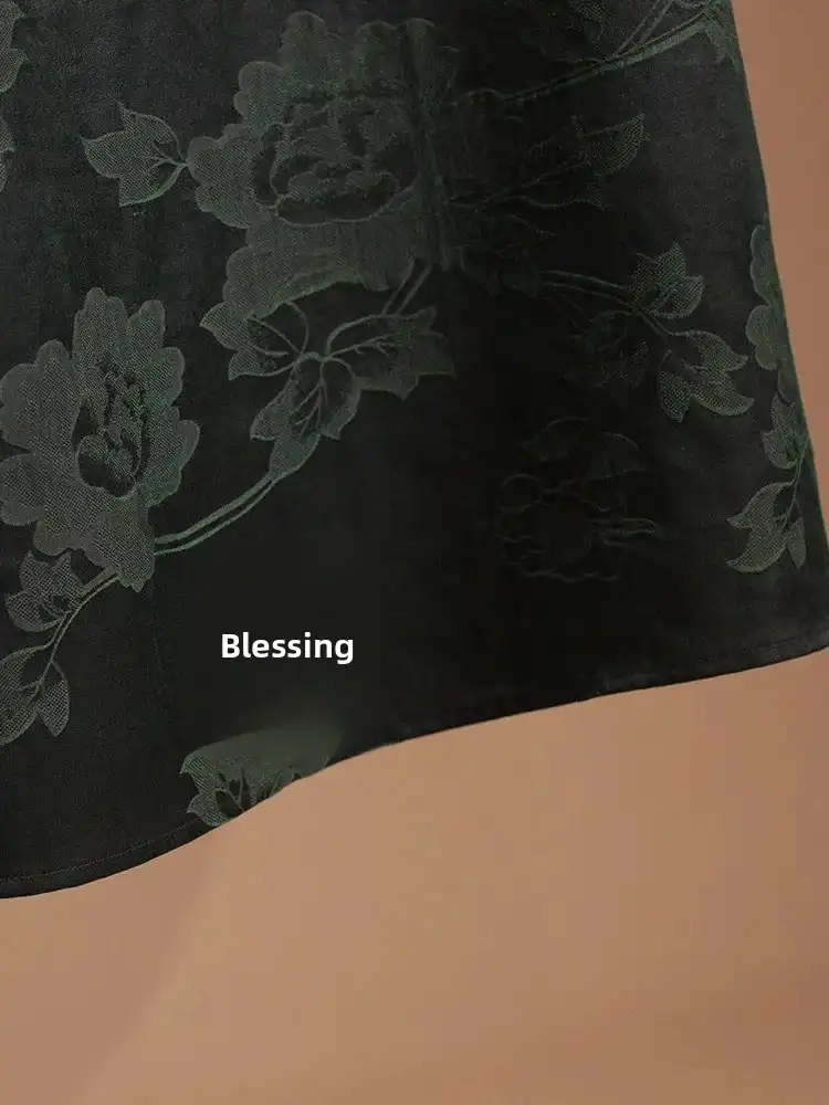 Front view of elegant Gambiered Guangdong silk Qipao dress with round neck and knee length design.