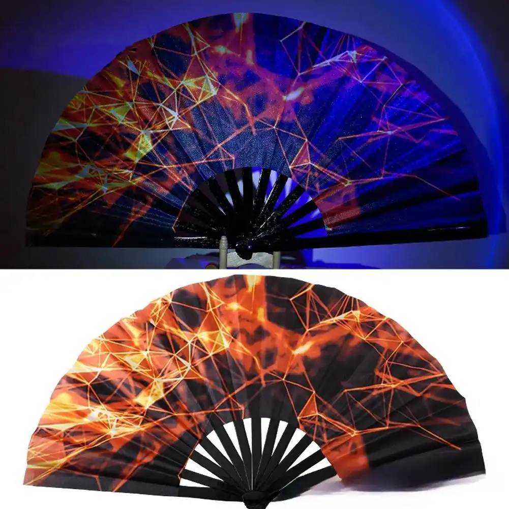 Fluorescent hand fan glowing brightly under UV black light demonstrating reactive ink technology at party.