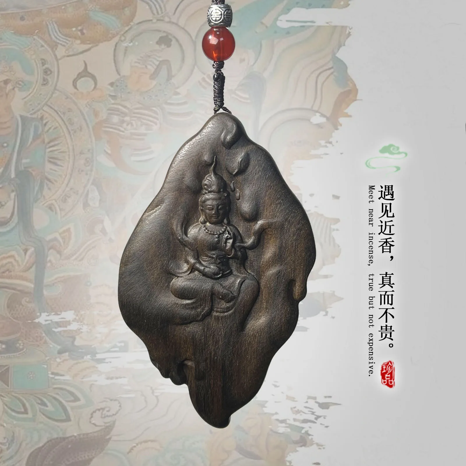 Handcrafted agarwood Guanyin carving Buddhist amulet pendant showing intricate face details.