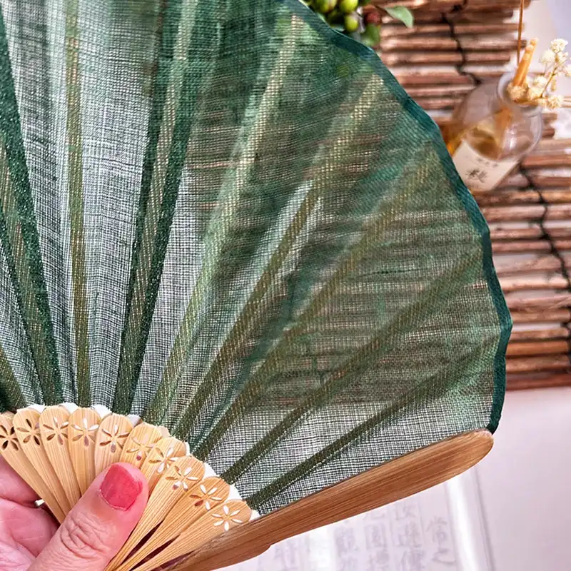 Close up view of curved fanbone structure showing unique shell silhouette and bamboo craftsmanship.