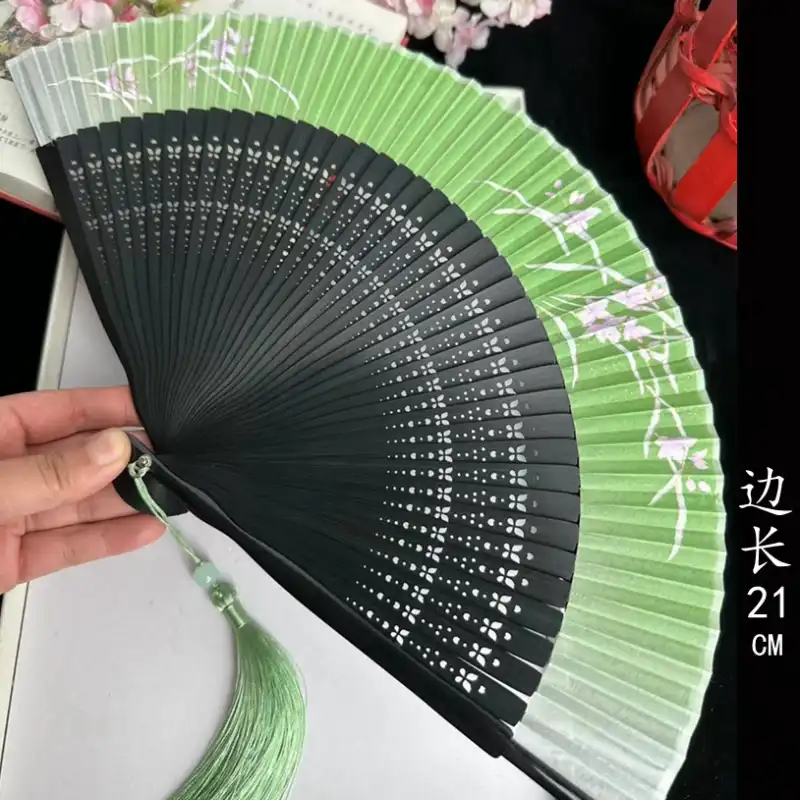 Japanese dragonfly folding fan opened showing bamboo ribs and lovely cloth covering with nature motifs.
