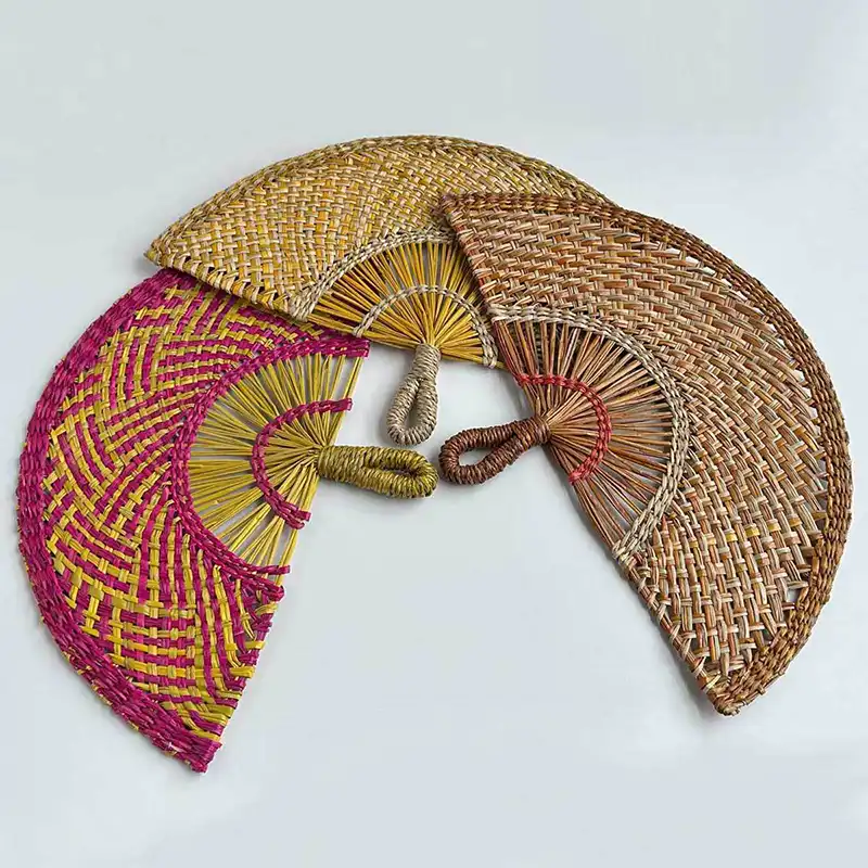 Traditional woven fan positioned as wall art adding cultural authenticity to living space.