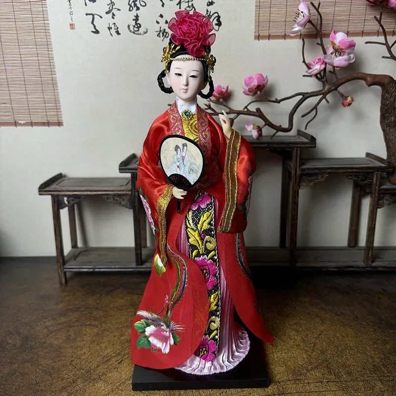 Traditional Chinese opera headdress and ornamental accessories on porcelain doll.