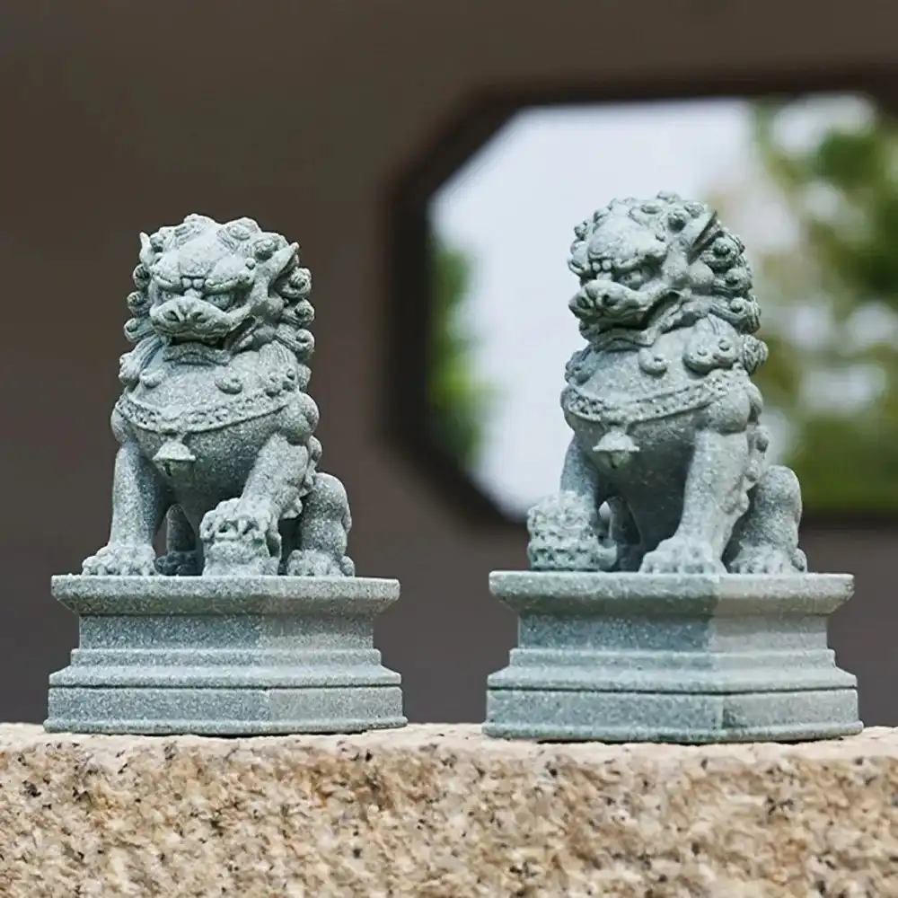 Detailed stone foo dog statue showing intricate carving traditional Chinese guardian lion craftsmanship.