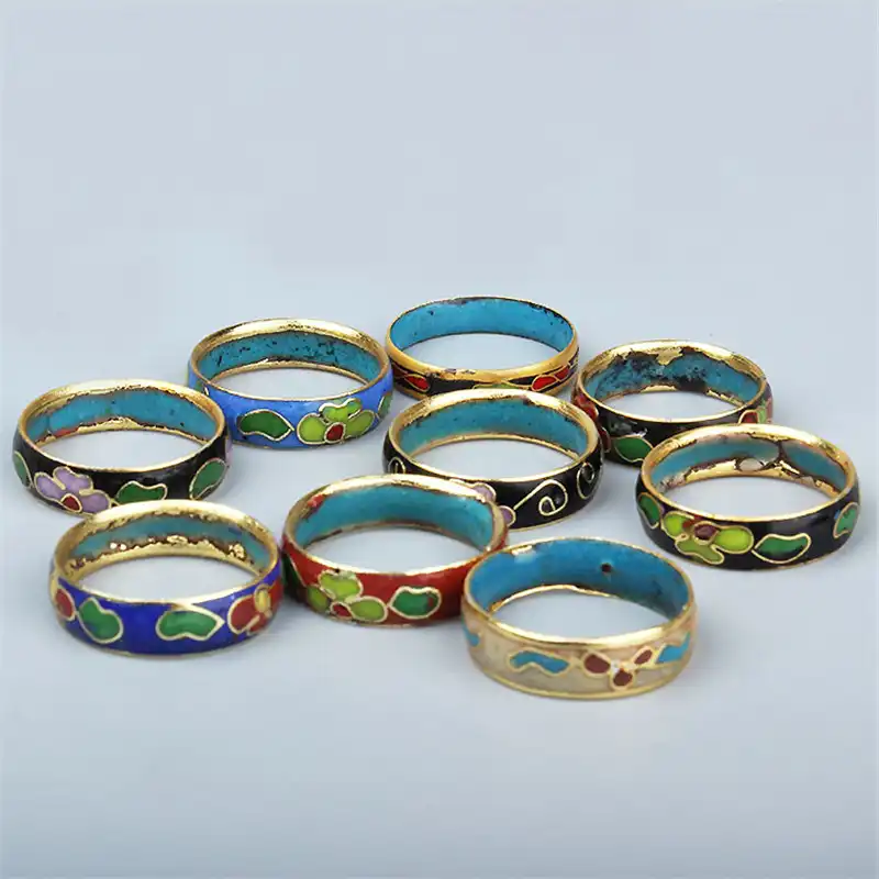 Individual cloisonne copper ring highlighting polished enamel surface and metal base.