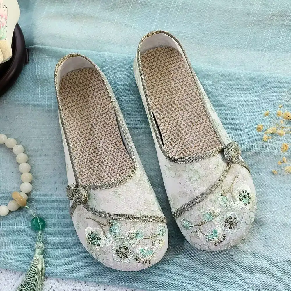 Detailed shot of rubber outsole and soft fabric construction of Old Beijing cloth shoes.