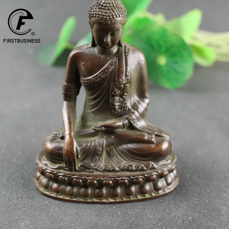 Buddhist statue incense burner in use with burning incense creating peaceful meditation atmosphere.