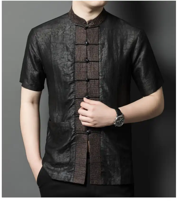Traditional Chinese Tang shirt styled with modern casual pants for contemporary look.