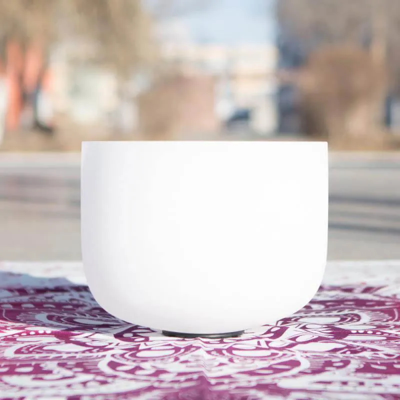 Crystal singing bowl detail showing transparent quartz material and handmade craftsmanship.