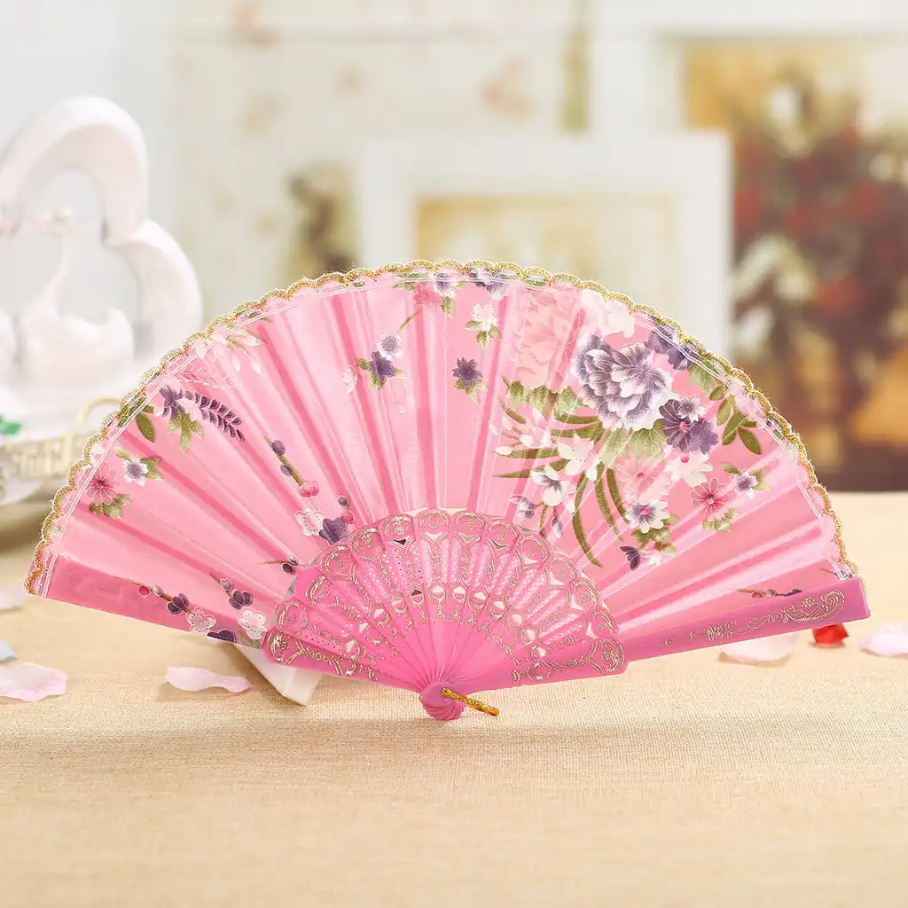 Hand demonstrating smooth opening motion of Japanese silk folding fan showing ease of use.