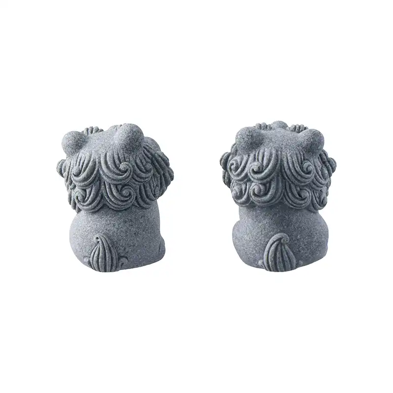 Desktop display of small chinese lion statues perfect for office or home altar decoration setup.