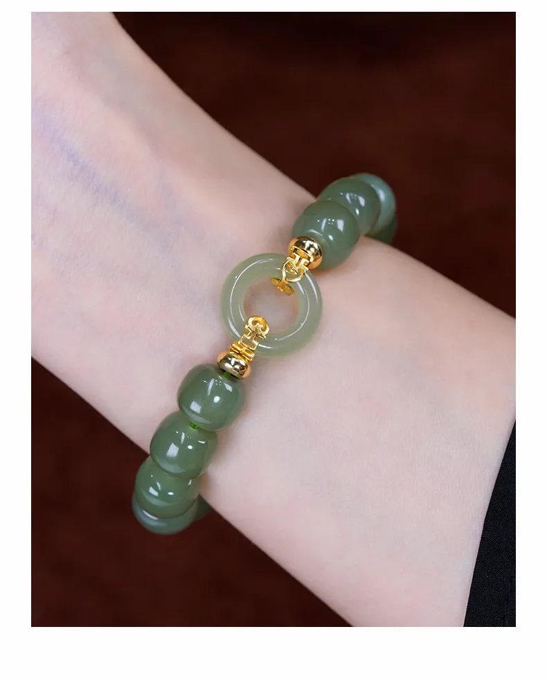 Elegant woman wearing vintage Hetian jade bracelet showcasing bohemian fashion style.