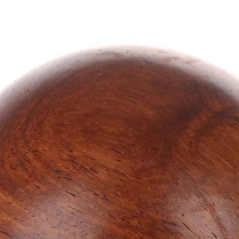Baoding balls in meditation setting with peaceful background for mindfulness and relaxation.