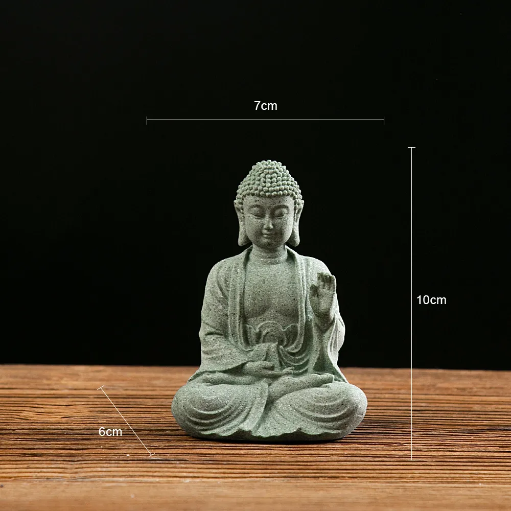 Small Buddha statue size comparison with hand showing compact mini figurine dimensions.