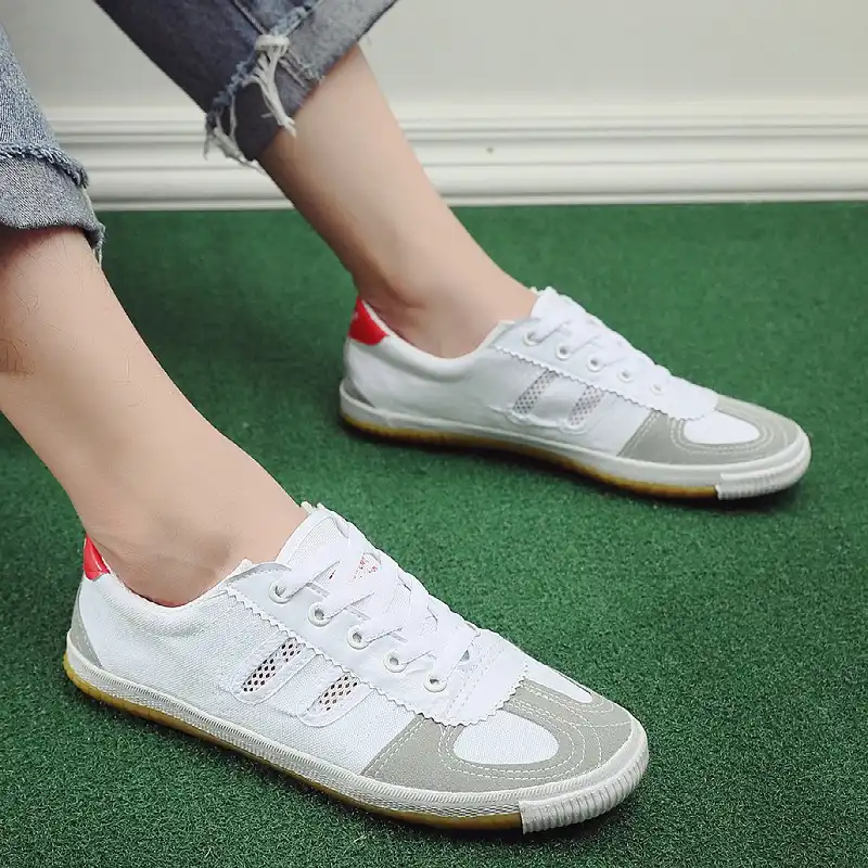 Flexible rubber outsole grip pattern providing traction for martial arts footwork and balance.