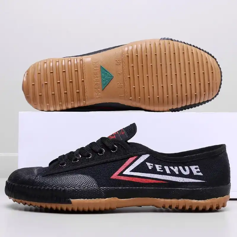 Top view of training shoes showing breathable nylon material and professional stitching.