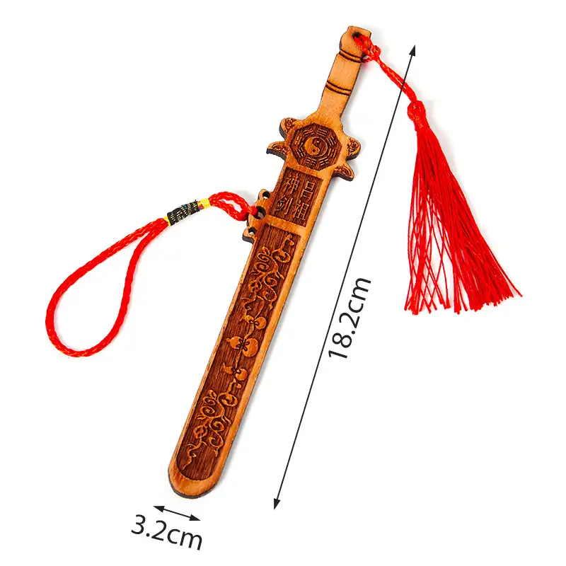 Traditional Chinese peach wood sword with Eight Diagrams displayed in feng shui arrangement setup.