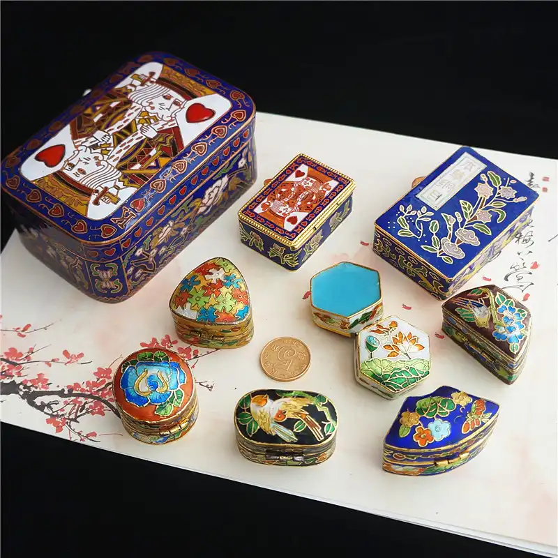 Close-up detail of cloisonne box lid featuring traditional hand-applied enamel and intricate designs.