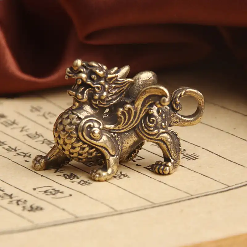 Brass Qilin statue showing detailed craftsmanship with dragon head and horse body feng shui design.
