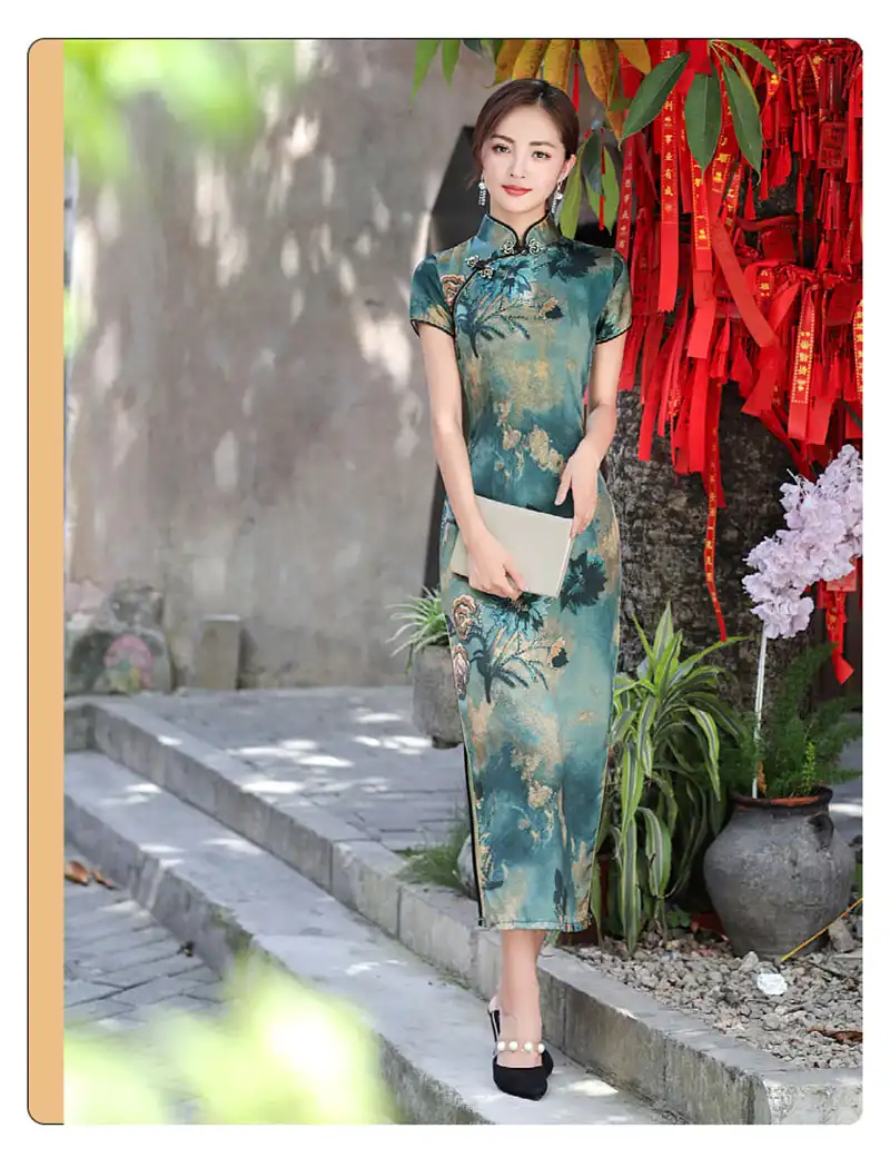 Model in vintage long qipao demonstrating movement and comfort in premium fabric.