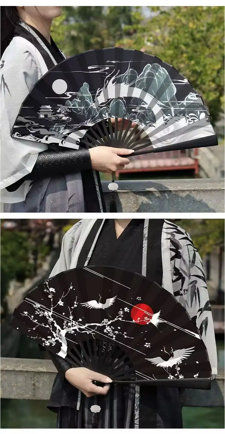Hand holding opened Chinese folding fan demonstrating 30cm length and comfortable grip.