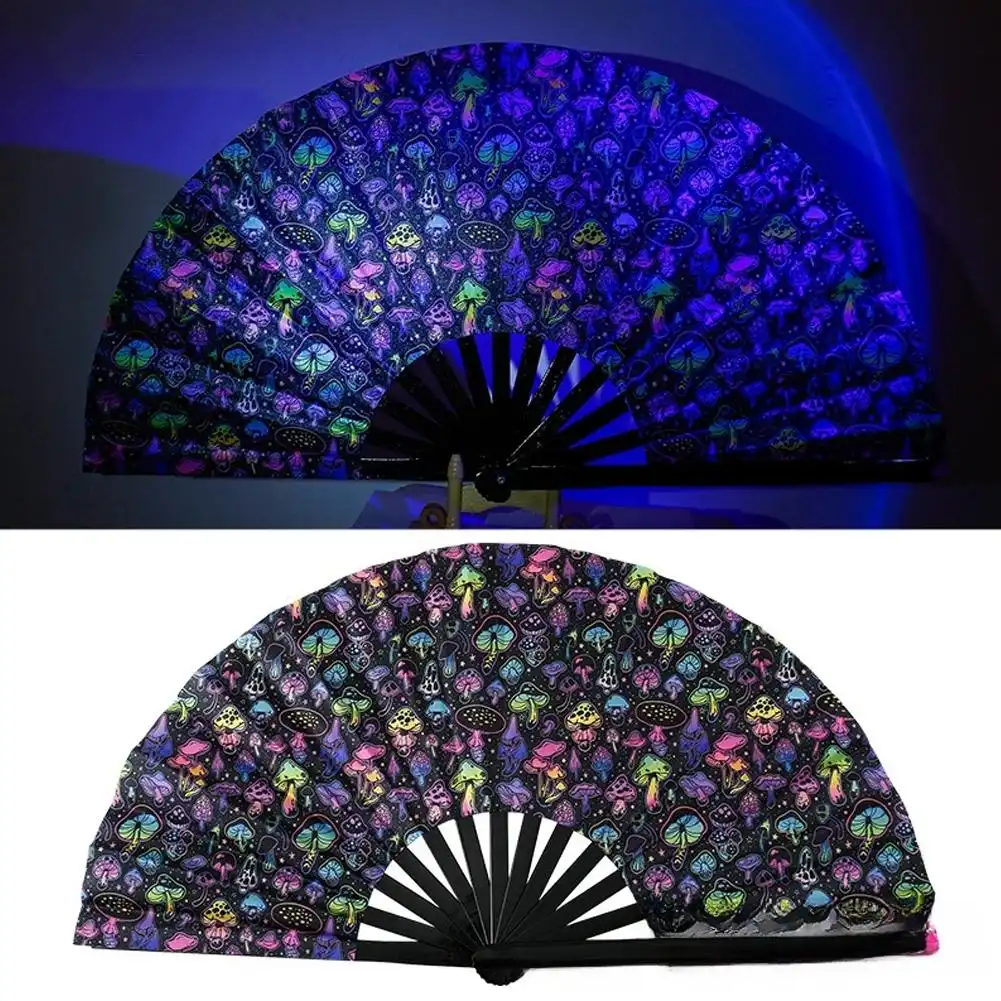 Person holding opened Chinese bamboo fan in dancing pose showcasing movement and fan flow for performances.