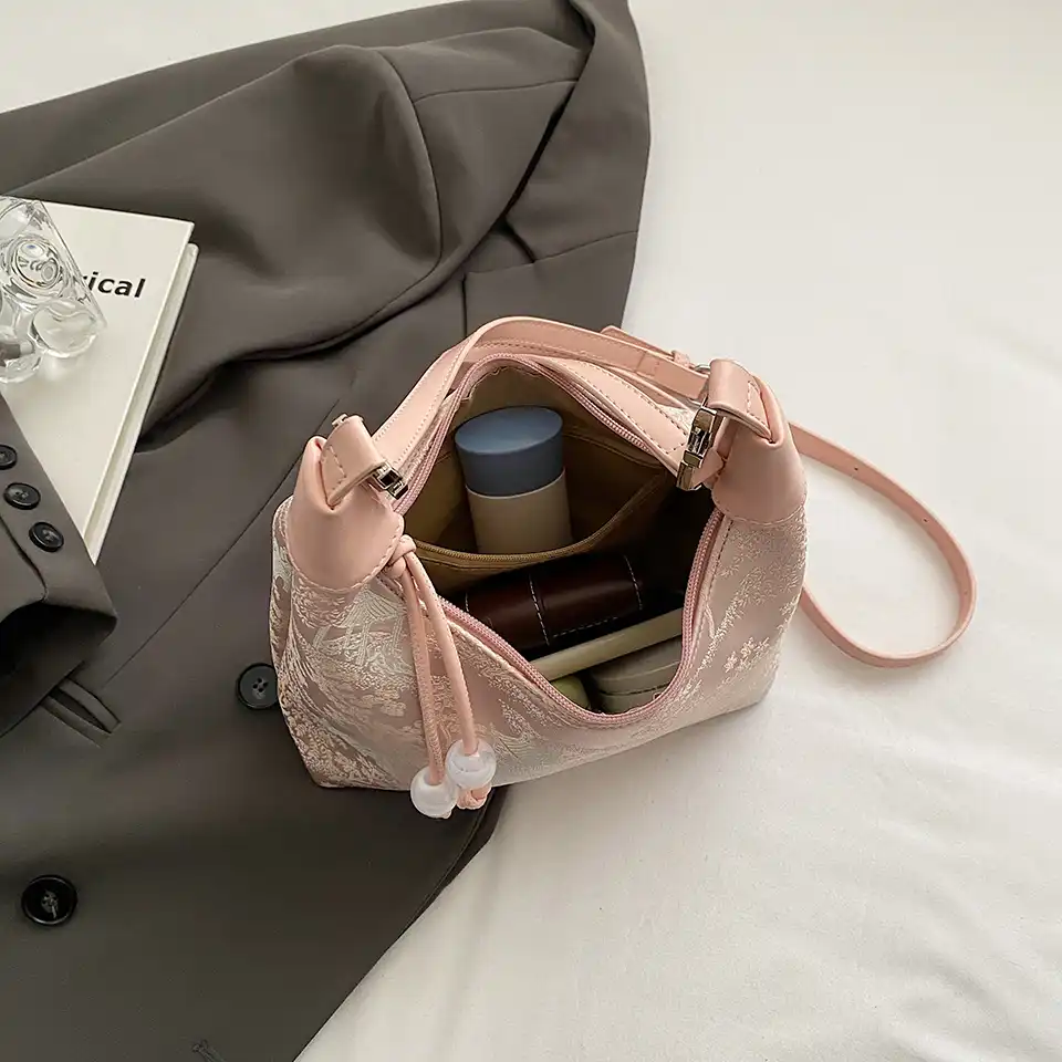 Interior view displaying cell phone pocket and polyester lining compartment.