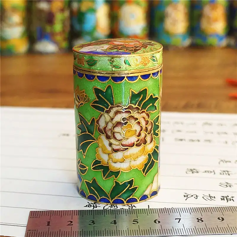 Top view of cloisonne toothpick holder opening showing interior storage space and lid design.