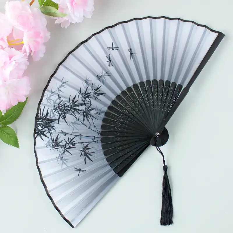 Detailed close-up of printed silk fabric showing traditional Chinese pattern artwork.