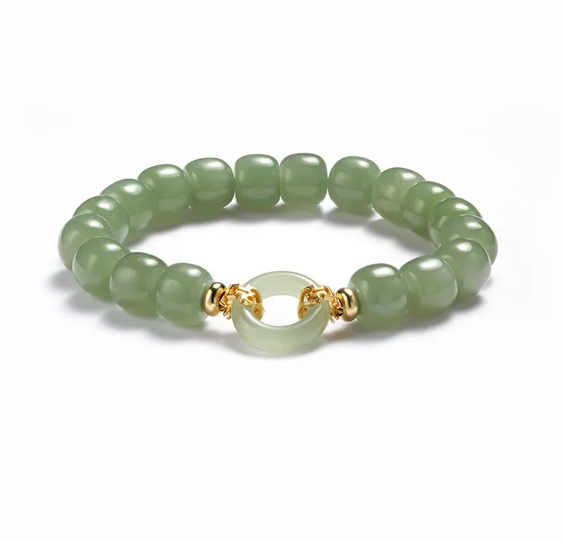 Multiple Hetian jade bracelets displayed showing variety of natural jade color variations.