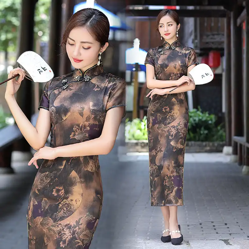 Back view of long cheongsam showing traditional silhouette and elegant draping.