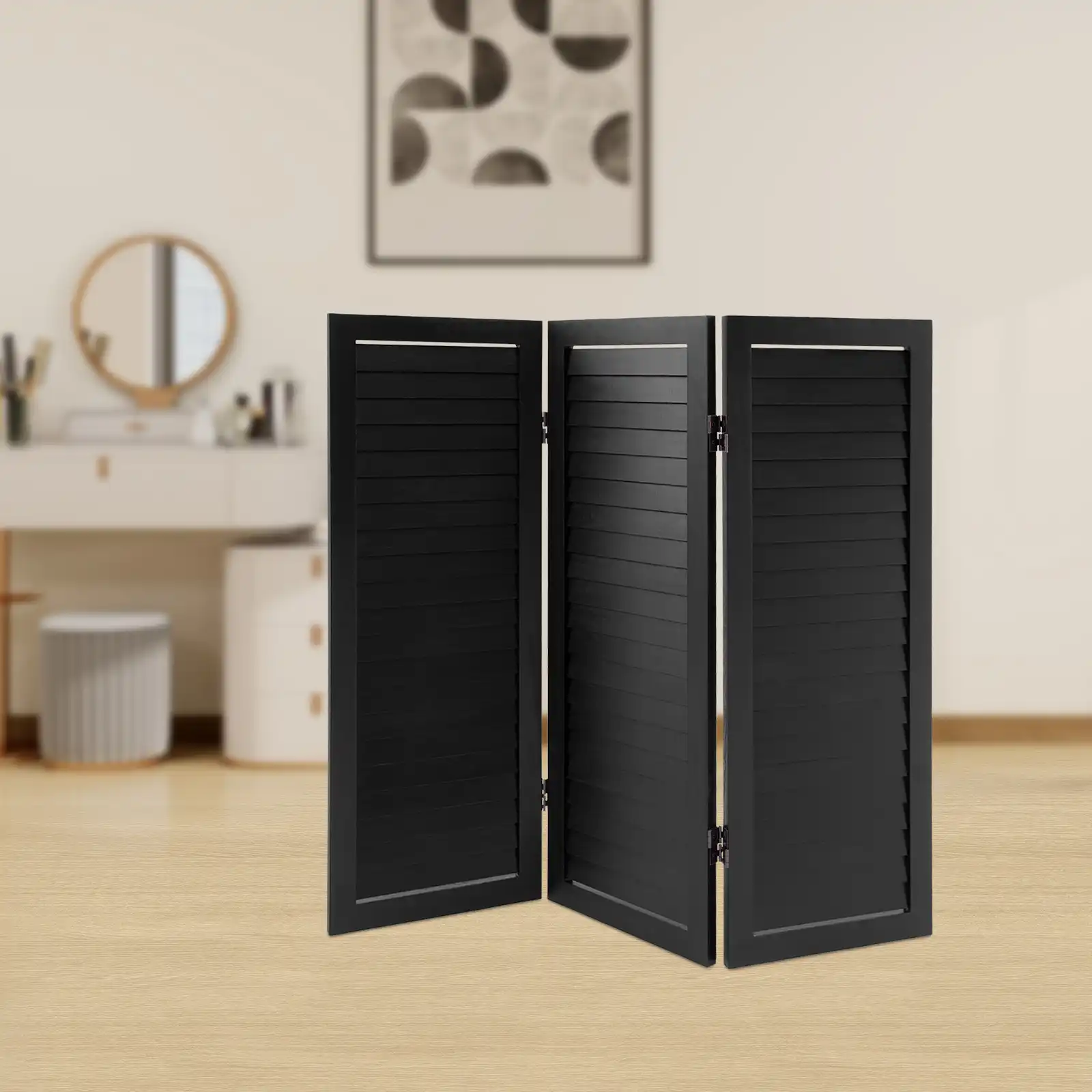 Black Chinese screen divider used as decorative backdrop for plants in home interior.