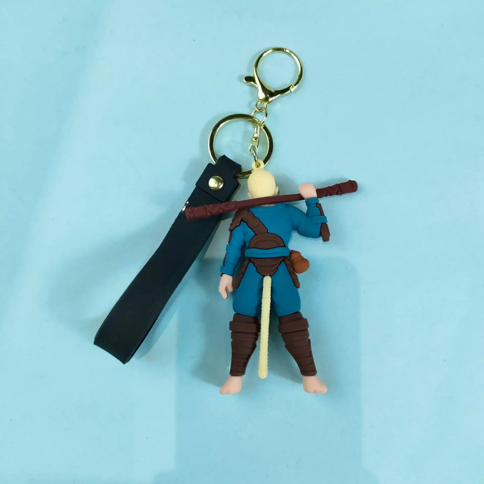 Close-up view of premium gaming keychain featuring Sun Wukong character design with detailed metal and rubber elements.