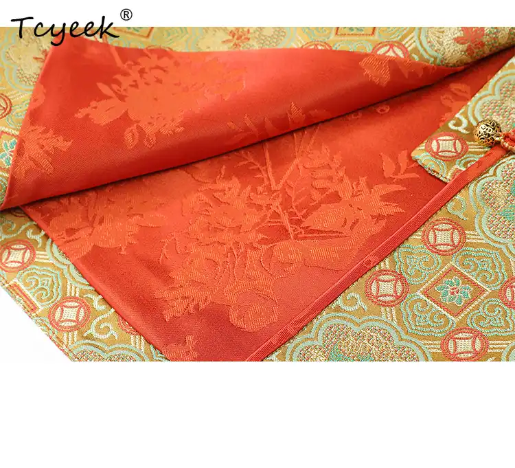 Close-up detail of single breasted closure and button details on Xiangyunsha silk coat.