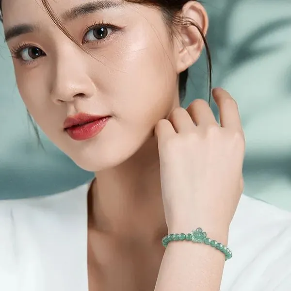 Traditional Chinese jade bracelet craftsmanship showing hand-polished natural stone quality.