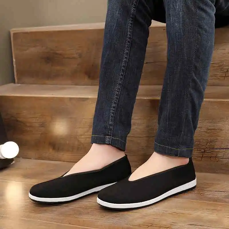 Martial arts training shoes styled with Wing Chun uniform demonstrating traditional appearance.