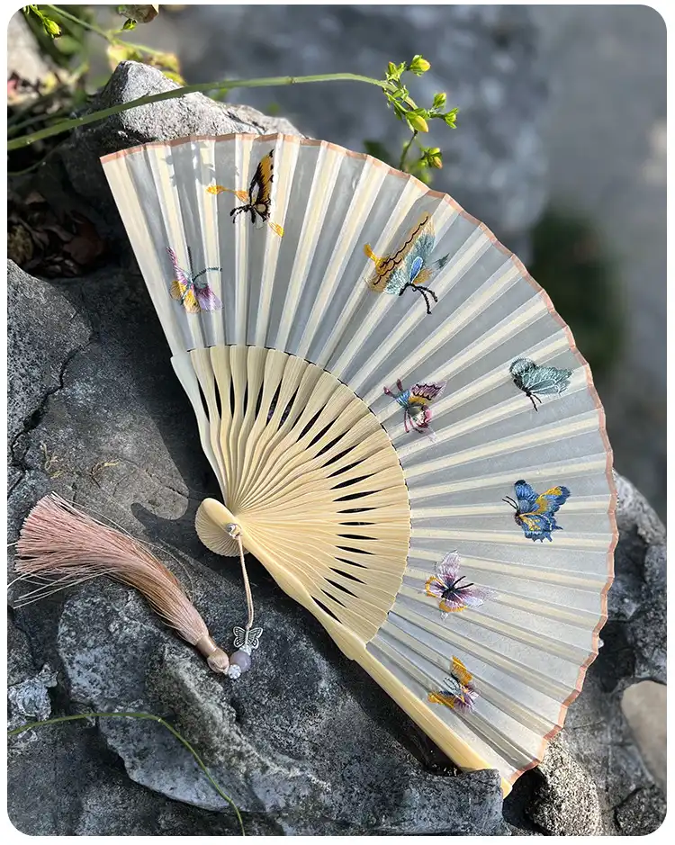 Bamboo ribs construction of decorative folding fan showing quality framework and joinery.