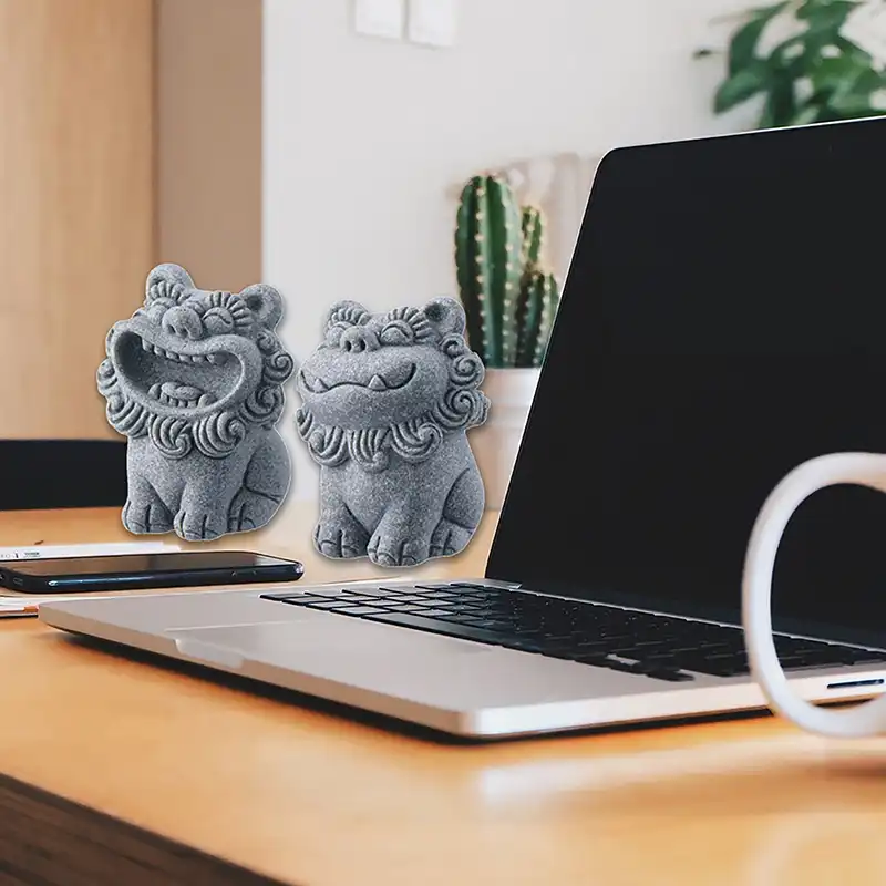 Pair of foo dog statues positioned together showing proper feng shui placement for maximum protection.