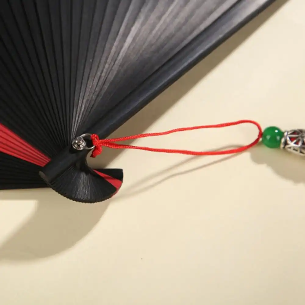 Detailed view of bamboo ribs and plastic covering showing durable construction materials.