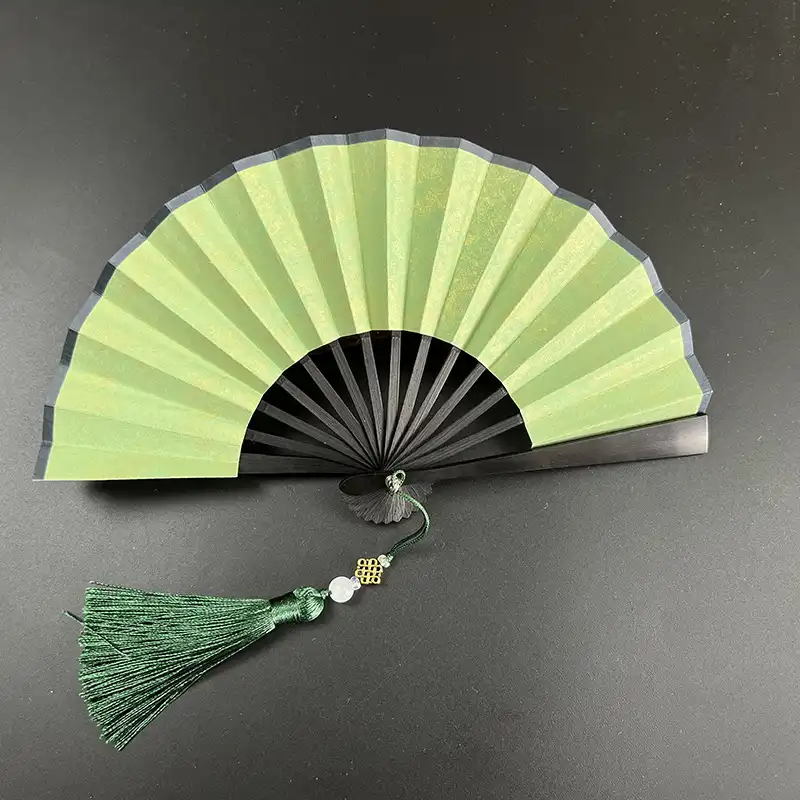 Wedding decoration setup featuring paper folding fans as elegant party accessories and table decor.