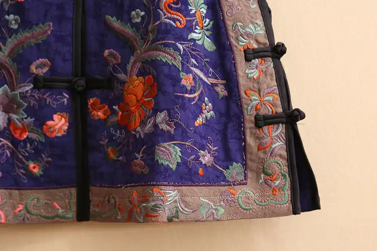 Back view of embroidered vest showing traditional Chinese needlework craftsmanship.