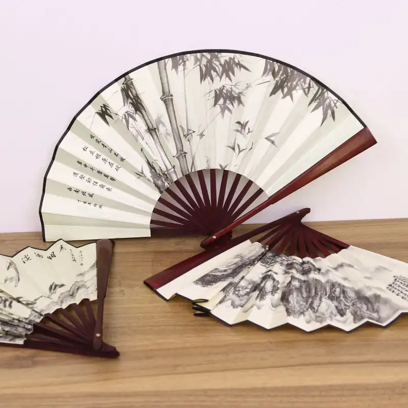 Multiple angle view showing fan thickness and profile when folded for convenient storage.
