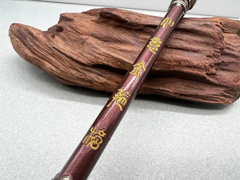 Comparison view of Ruyi Jingu Bang staff model next to game screenshot reference