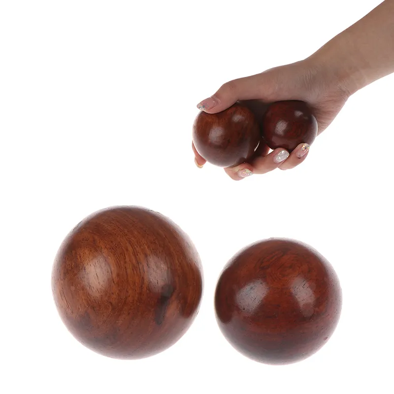 Hands demonstrating proper Baoding ball rotation technique for stress relief and hand exercise.
