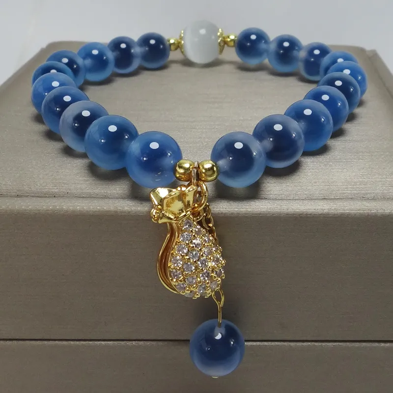 Blue agate strand bracelet showing geometric pattern and natural crystal healing properties.