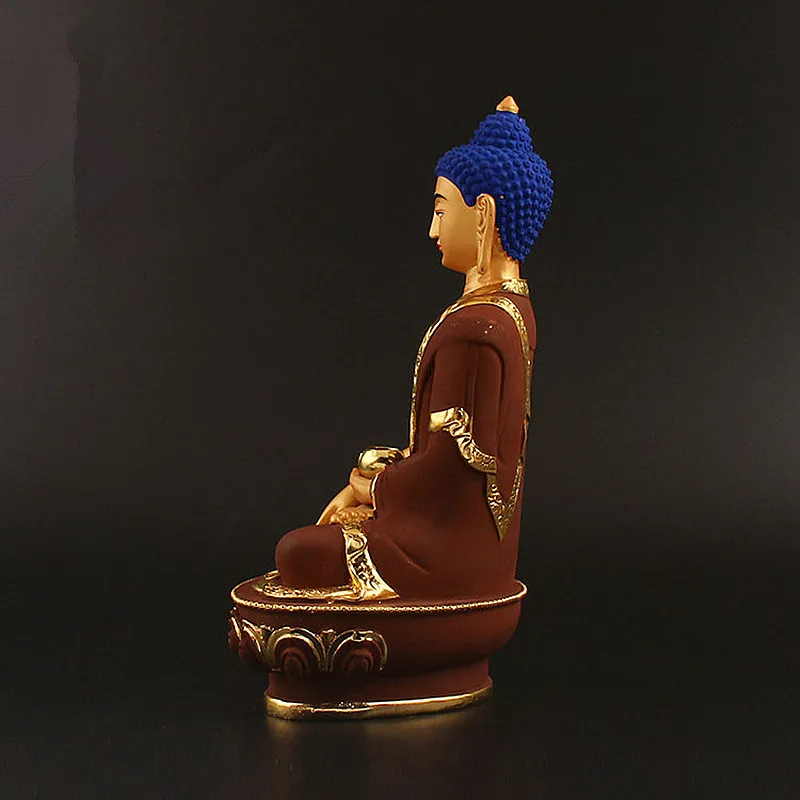 Earth touching mudra hand position Shakyamuni Buddha statue traditional pose enlightenment.
