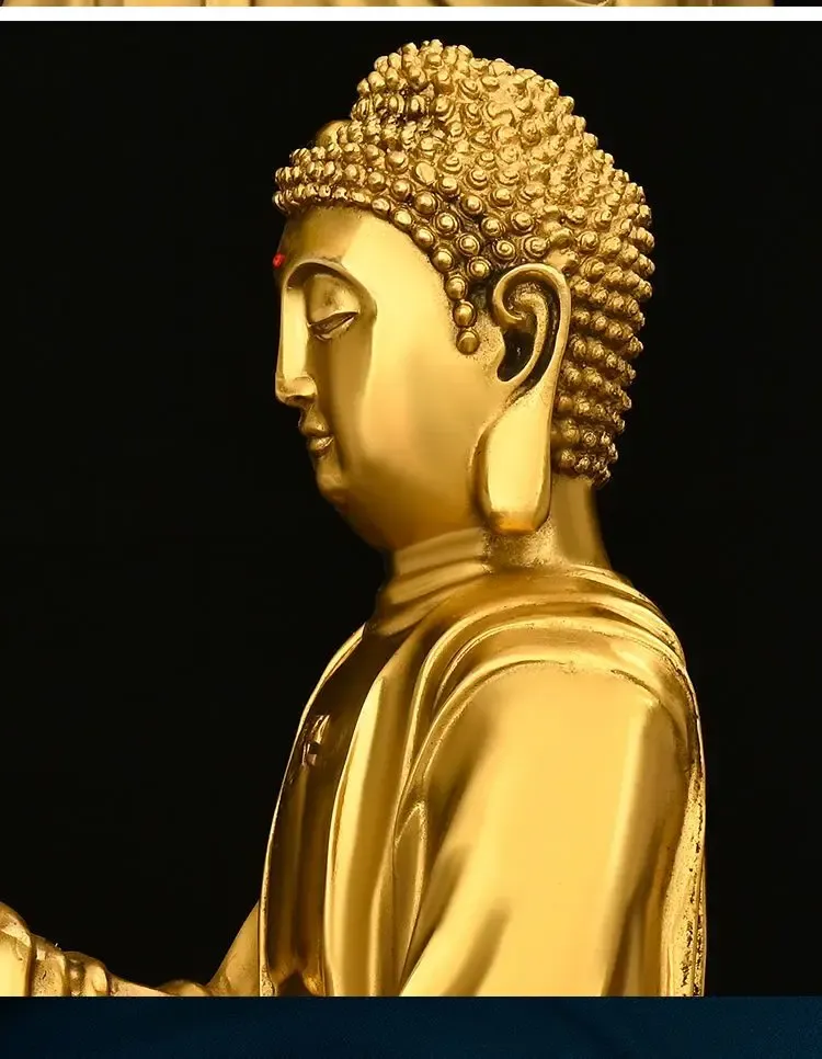 Close-up detail of Buddha statue face showing intricate craftsmanship and serene expression.