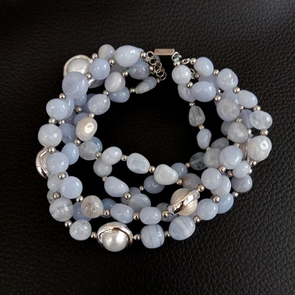 Close-up view of 7-8mm blue lace agate freeform beads displaying natural patterns and color.